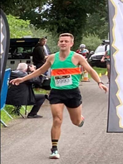 INTER COUNTY MATCH WITHIN THE FARNDON 10km RACE, 23.9.2023, Tomos Roberts takes the tape.